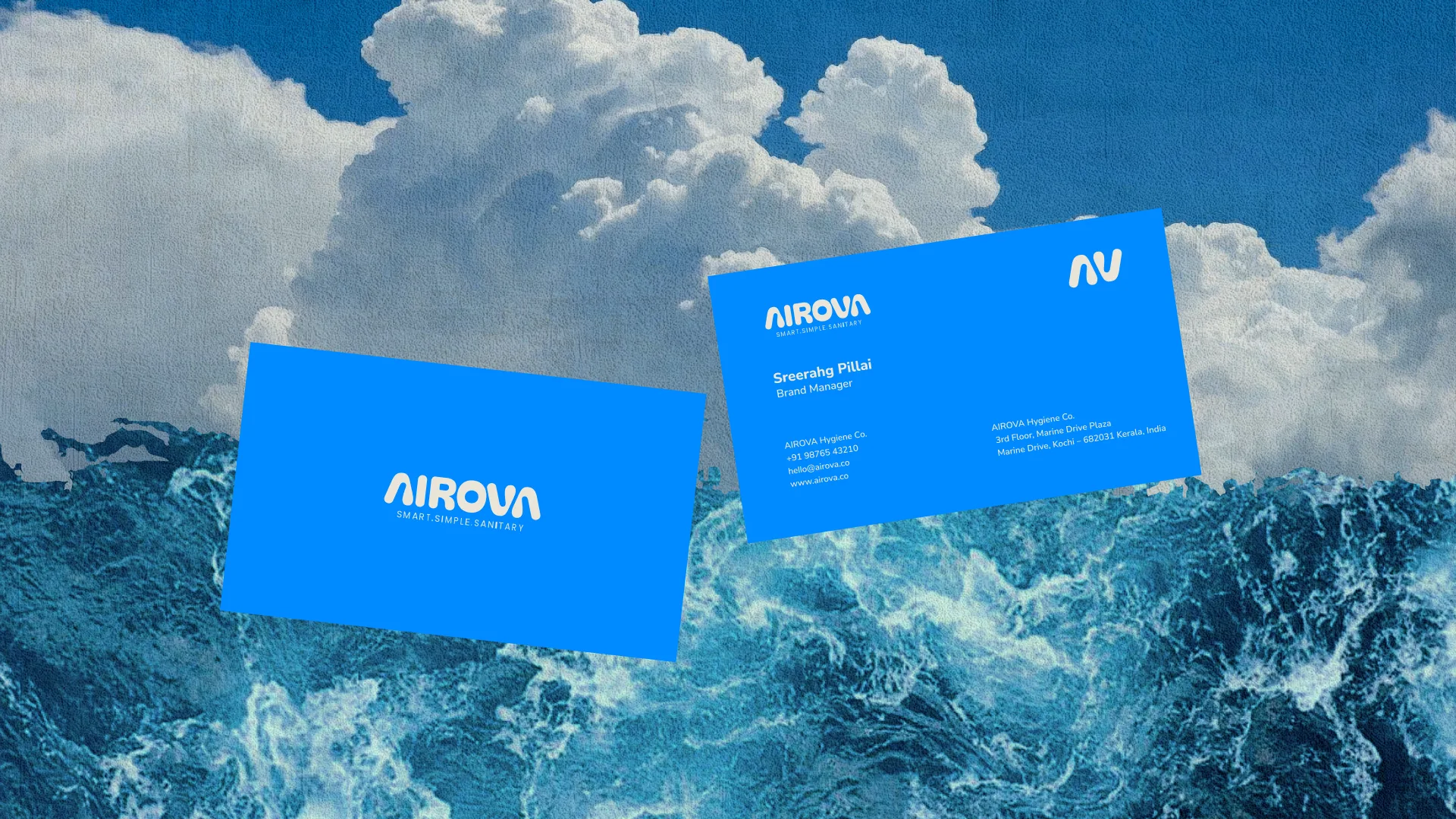 Two Airova business cards floating over a photograph of storm cloud and open sea
