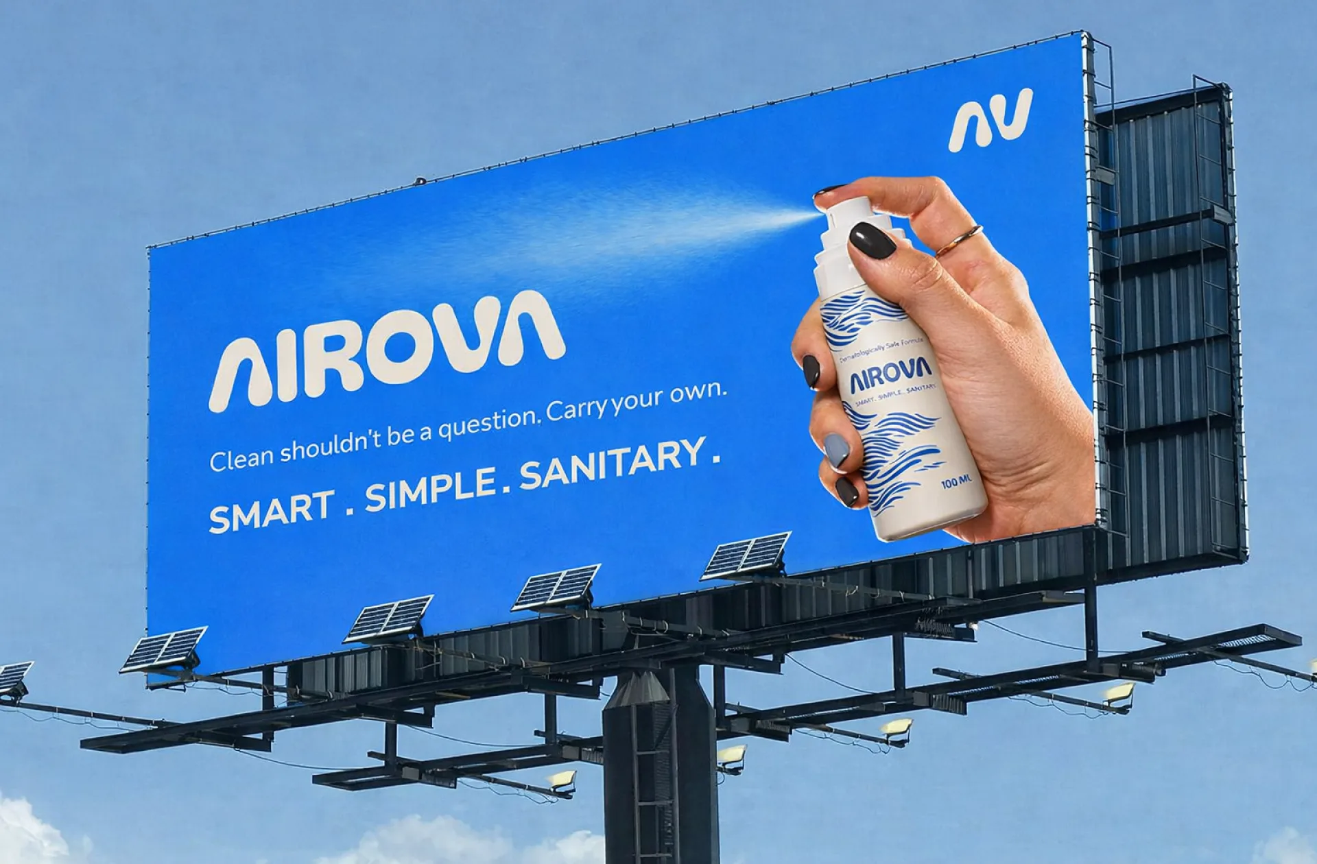 The campaign on a roadside billboard against open sky, the bottle held out at full scale