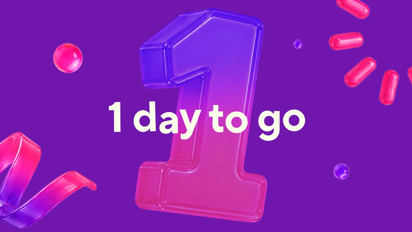 Countdown screen: a glossy 3D numeral one among floating confetti capsules and ribbon, under the line 1 day to go