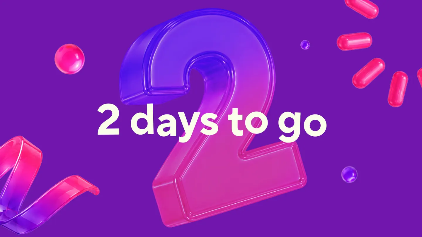 Countdown screen: a glossy 3D numeral two among floating confetti capsules and ribbon, under the line 2 days to go